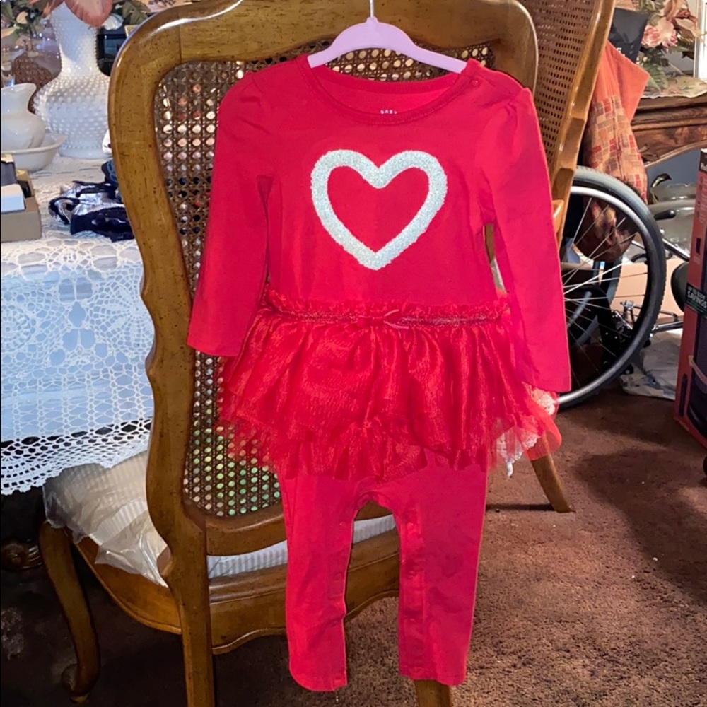 A one piece with tutu attached with a heart